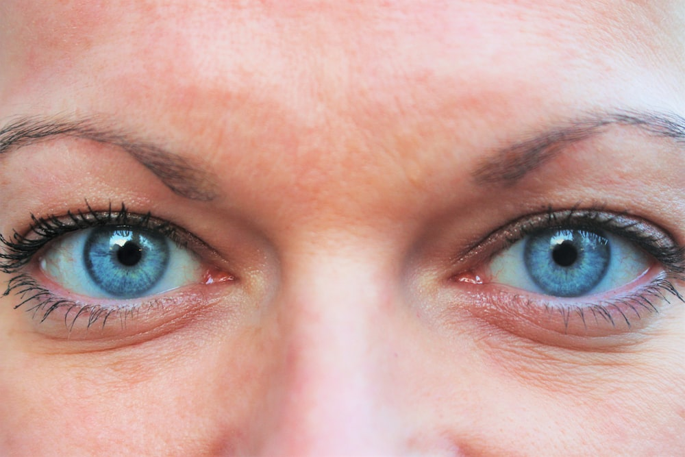 Close-up shot of a person’s blue eyes
